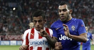 Juventus__Tevez_challenges_Olympiakos__Elabdellaoui_during_their